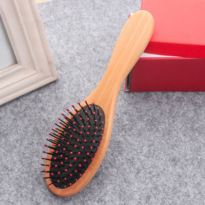 brosse à cheveux en bois, Forme ovale, picot couleur rose et fond noir - PBS - Naturopathie & Zéro déchet